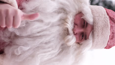 portrait of an american santa claus giving a thumbs up portrait of an american santa claus giving a thumbs up