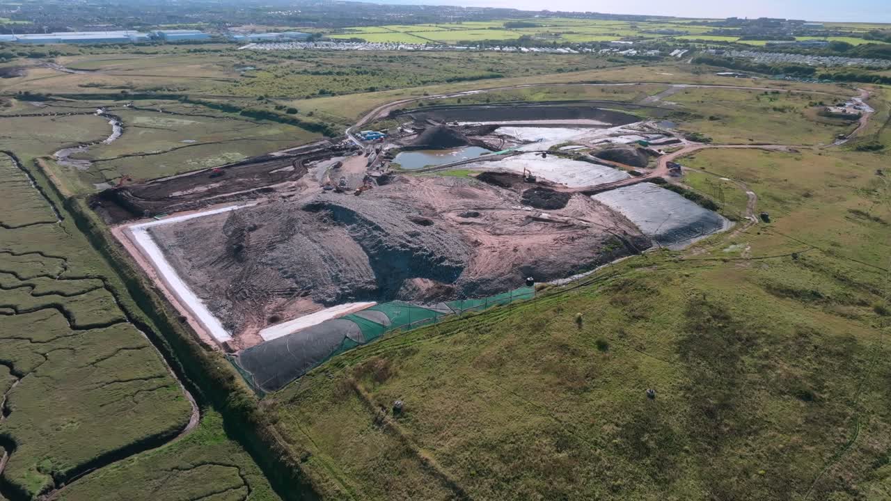 Aerial View Of Large Landfill Scar On Landscape Next To River Wyre. Vehicles And Flocks Of Seagulls. Jameson Road Landfill And Recycling Site, Fleetwood, UK