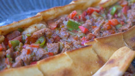 turkish pide with meat and peppers