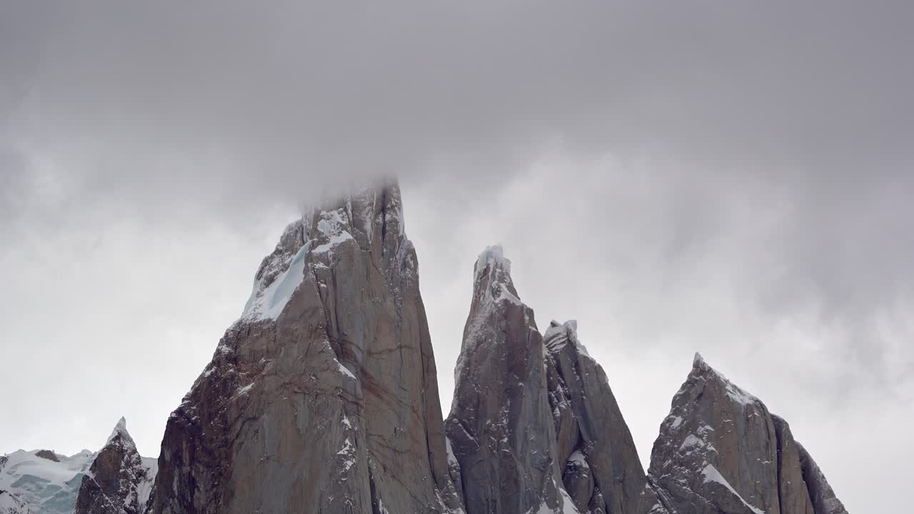 Time lapse of cerro torre on a stormy day with clouds moving at high speed