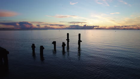 broken port poles left in the sea bank