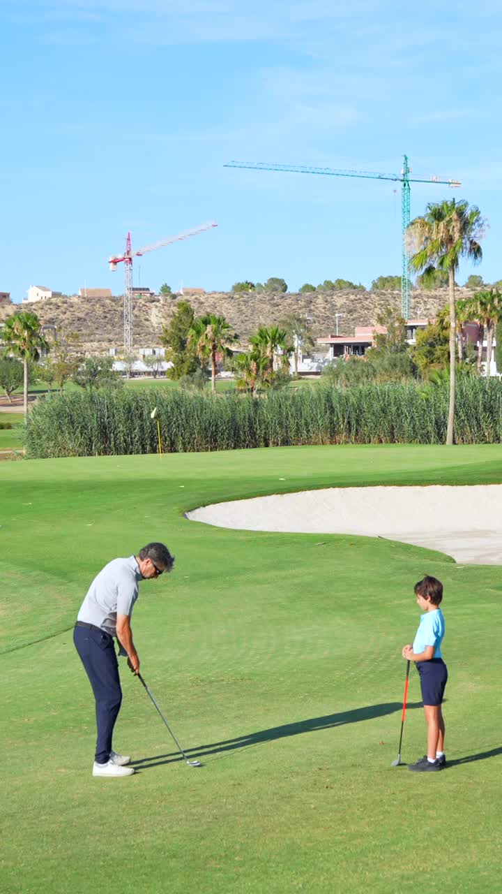 Father and Son Golfing on a Sunny Day
