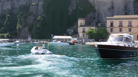 two boats navigating near sorrento, naples, italy