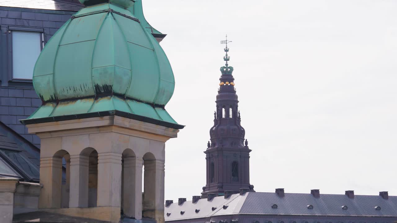 Building rooftops and Christiansborg Palace tower in background, Copenhagen
