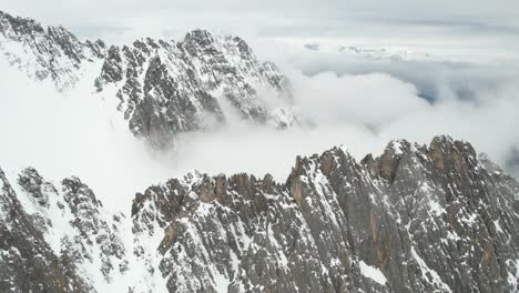 Aerial-View-of-Snow-Capped-Rocky-Peaks-of-Australian-Alps,-Innsbruck-Ski-Resort-Area,-Drone-Shot