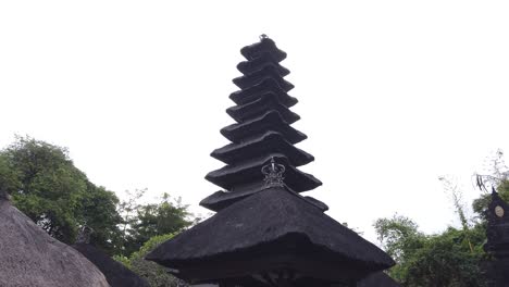 Balinese-Temple-Roof-over-Skyline,-Bali-Indonesia,-Religious-Hindu-Architecture,-Pyramidal,-Tall,-High-Level