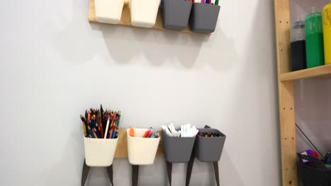 children colourful pens and shelves