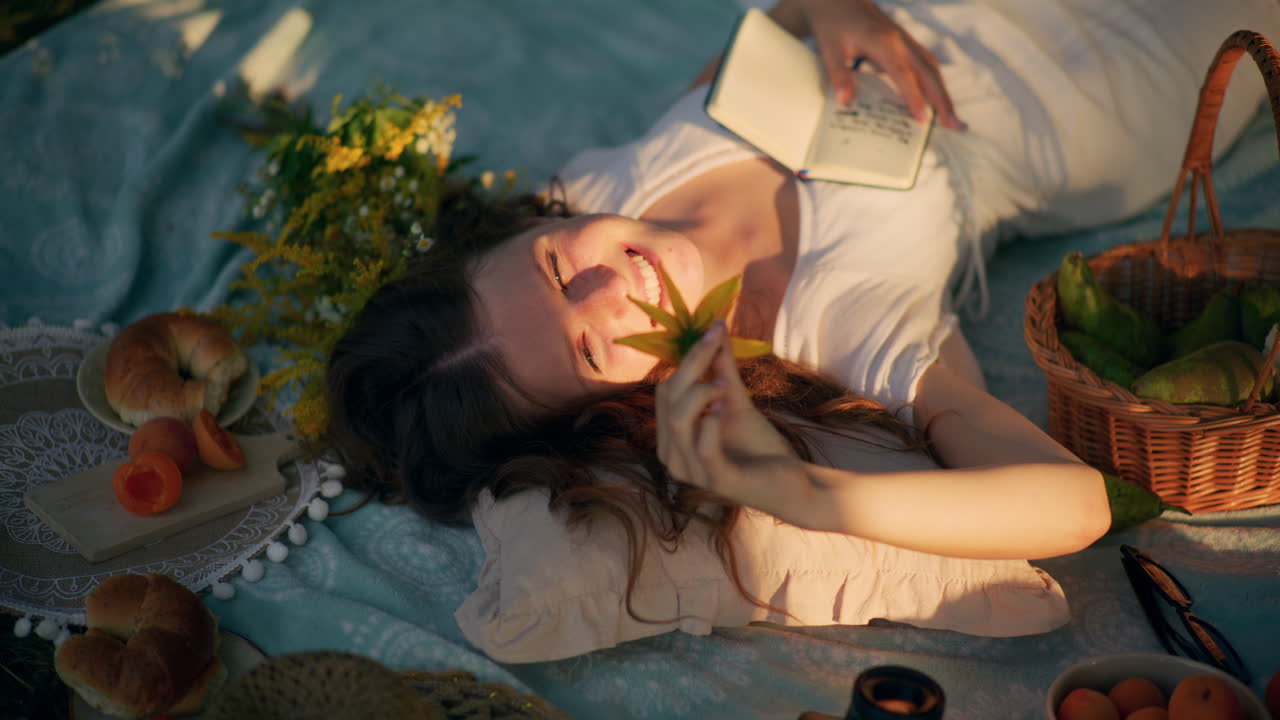 Girl daydreams in the heart of a meadow