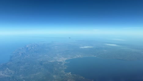 jet crossing track near mallorca island, spain, mediterranean sea