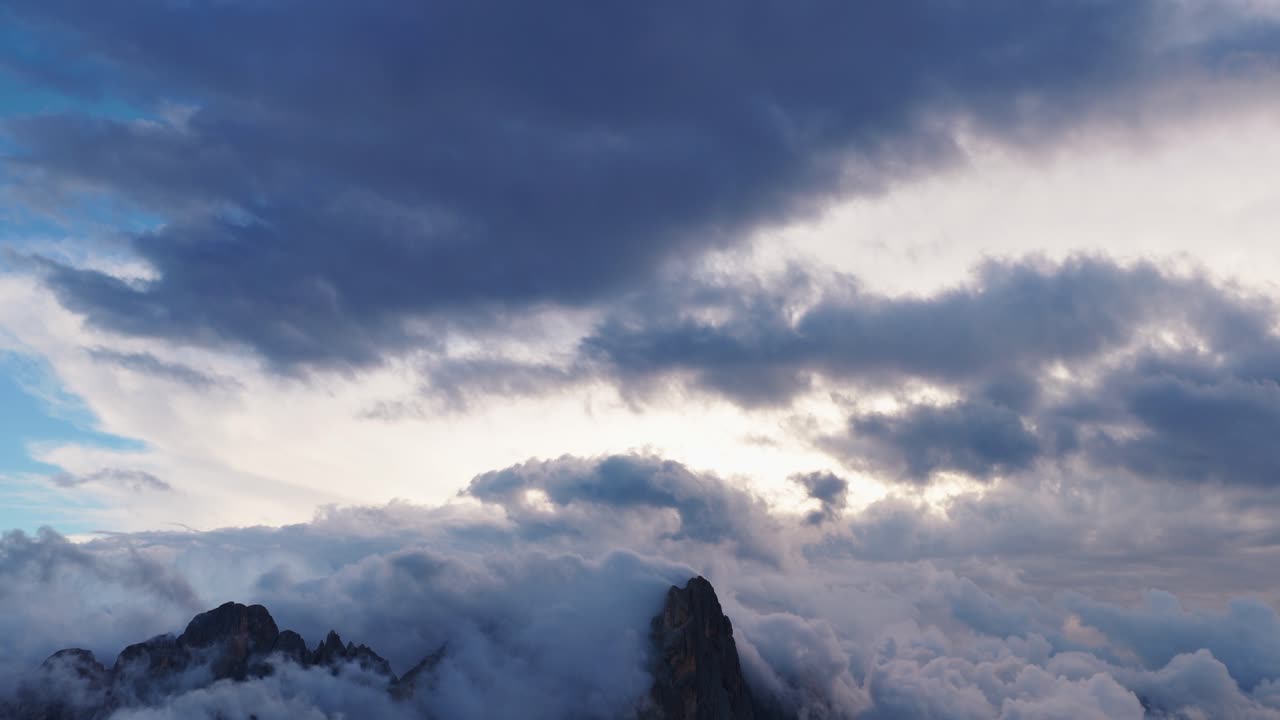 Dramatic clouds over Pale di San Martino, Dolomites, serene atmosphere