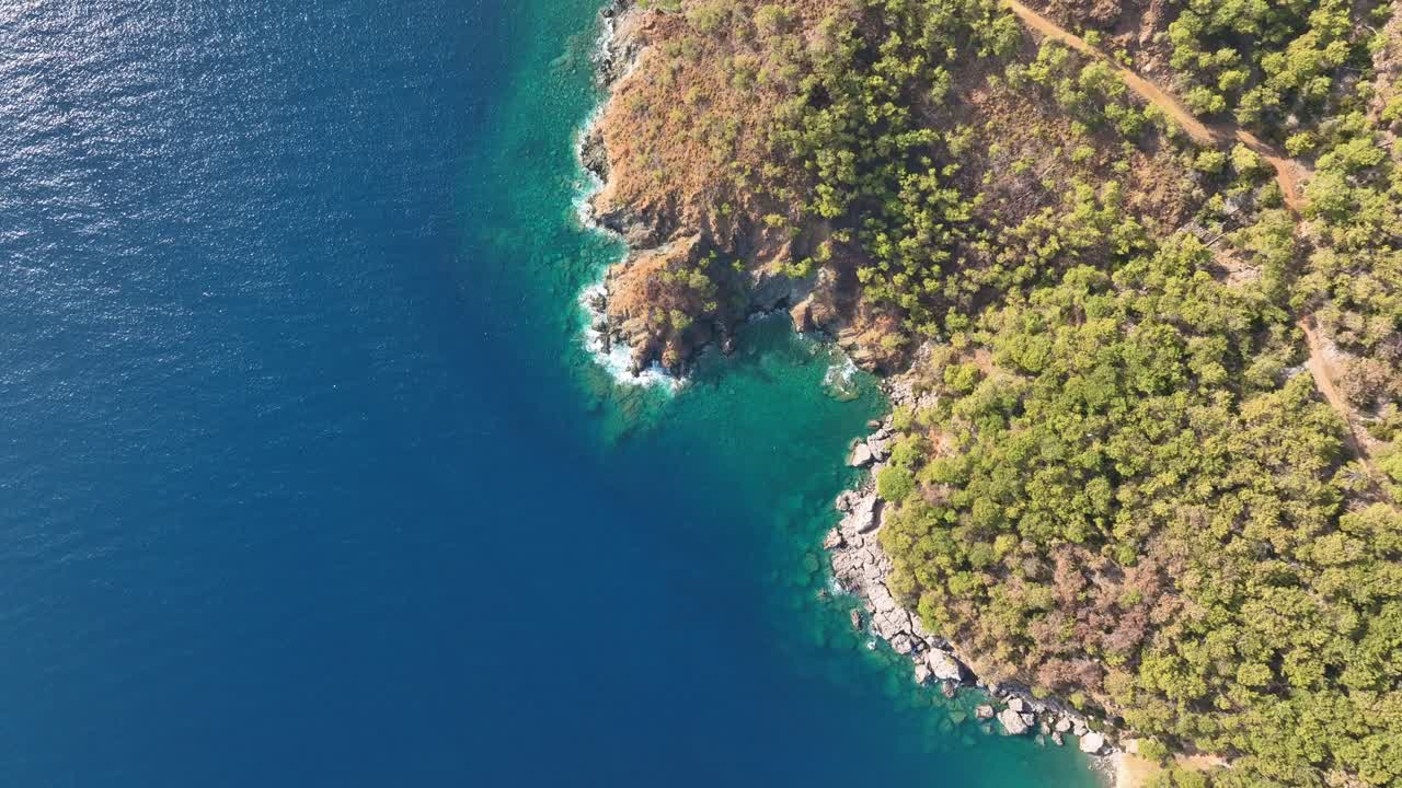 Aerial view of a rocky coastline meeting the ocean