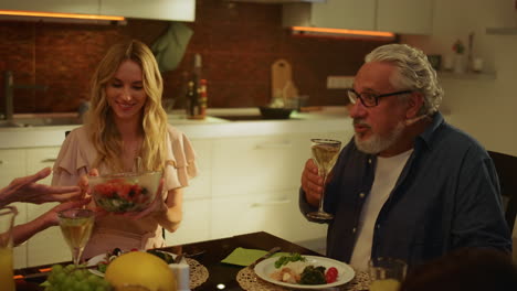 Family-gathering-for-festive-at-home.-Senior-man-making-toast-with-glass-of-wine