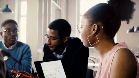 multiracial trading company board meeting. young happy creative employees brainstorming in modern light office space 4k