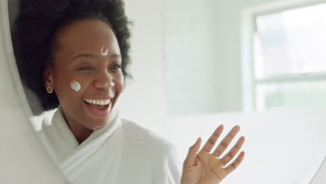 face sunscreen or cream on black woman in bathroom