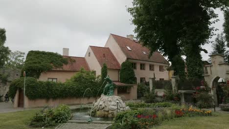 small fountain in the old town of visby, gotland island, sweden, circle pan, day