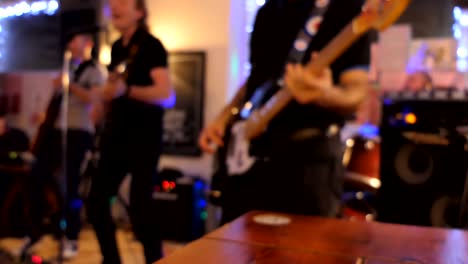 band playing in english pub blurred