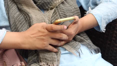 Close-up-of-women-hand-holding-smart-phone