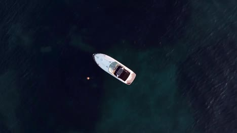 Drone-shot-of-a-boat-anchored-on-the-open-sea