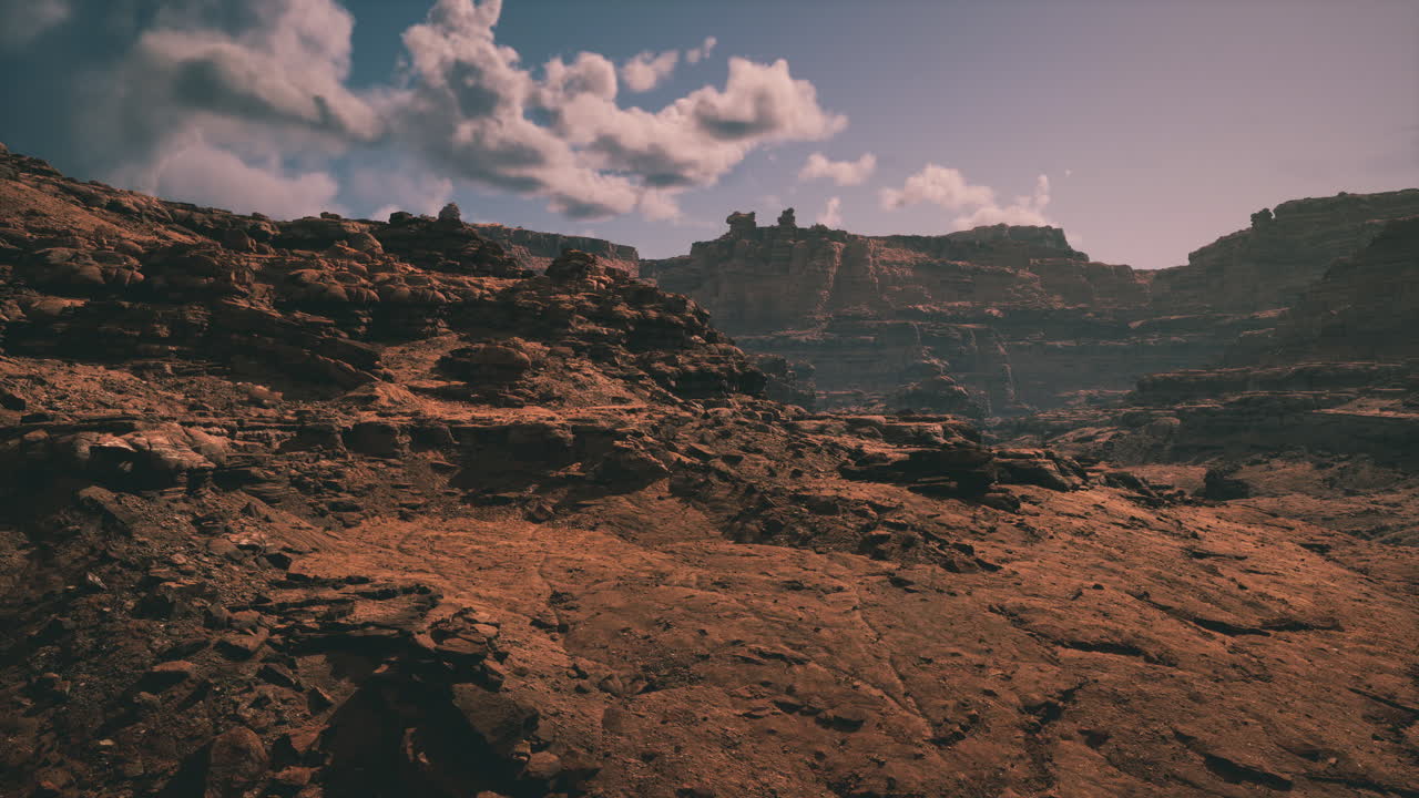 Breathtaking view of rugged desert landscape under dramatic sky at sunset