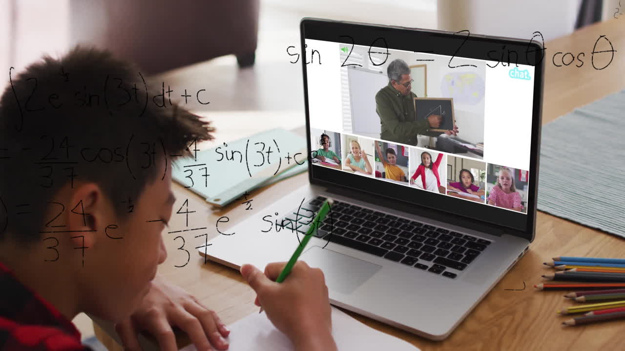 In school, child studying math with teacher and classmates using animation on laptop