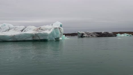 massive iceberg in the waters of jokulsarlon glacial lake