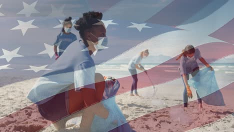 Animation-of-flag-of-united-states-of-america-over-people-in-face-masks-cleaning-beach