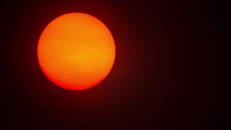 red sun sphere in thick smog