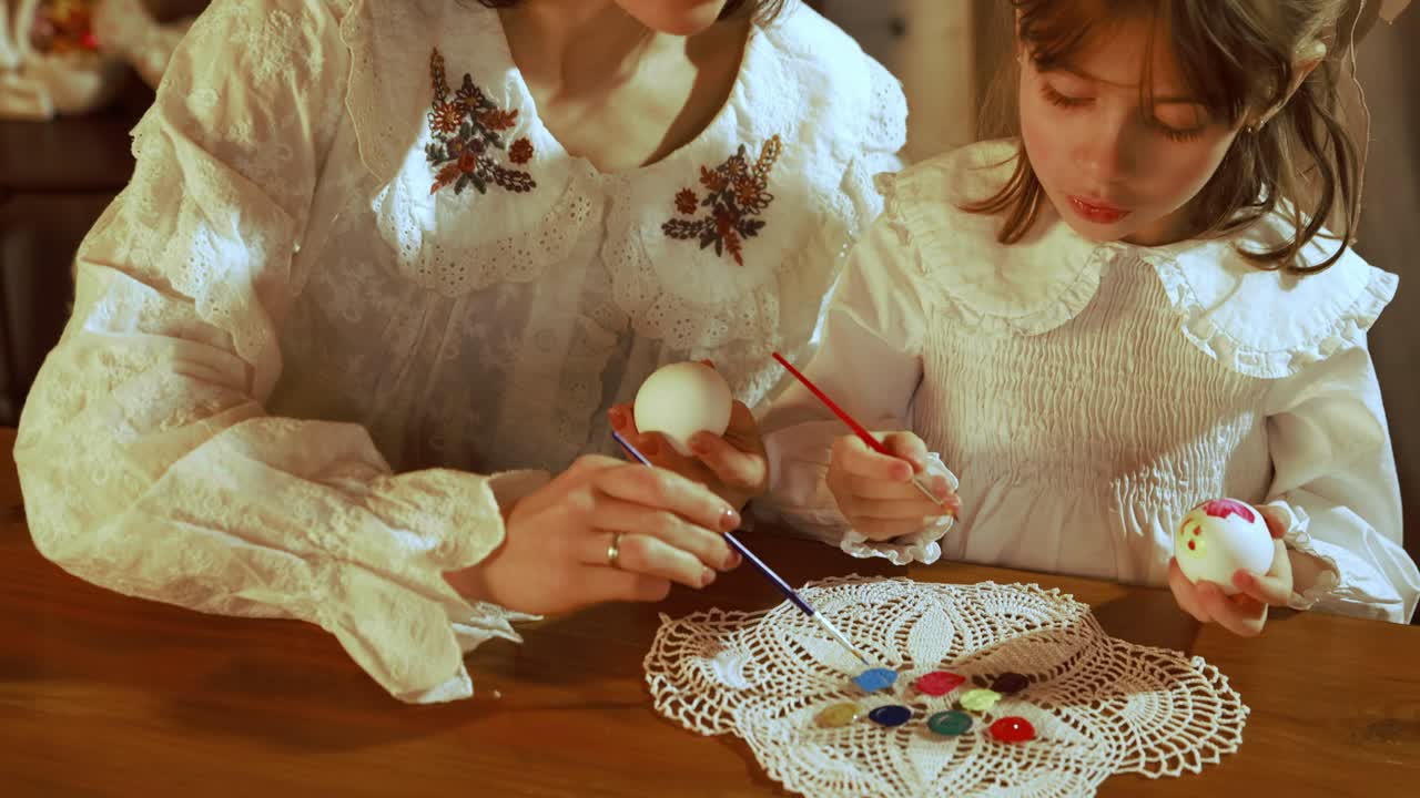 Mother and Daughter Painting Easter Eggs