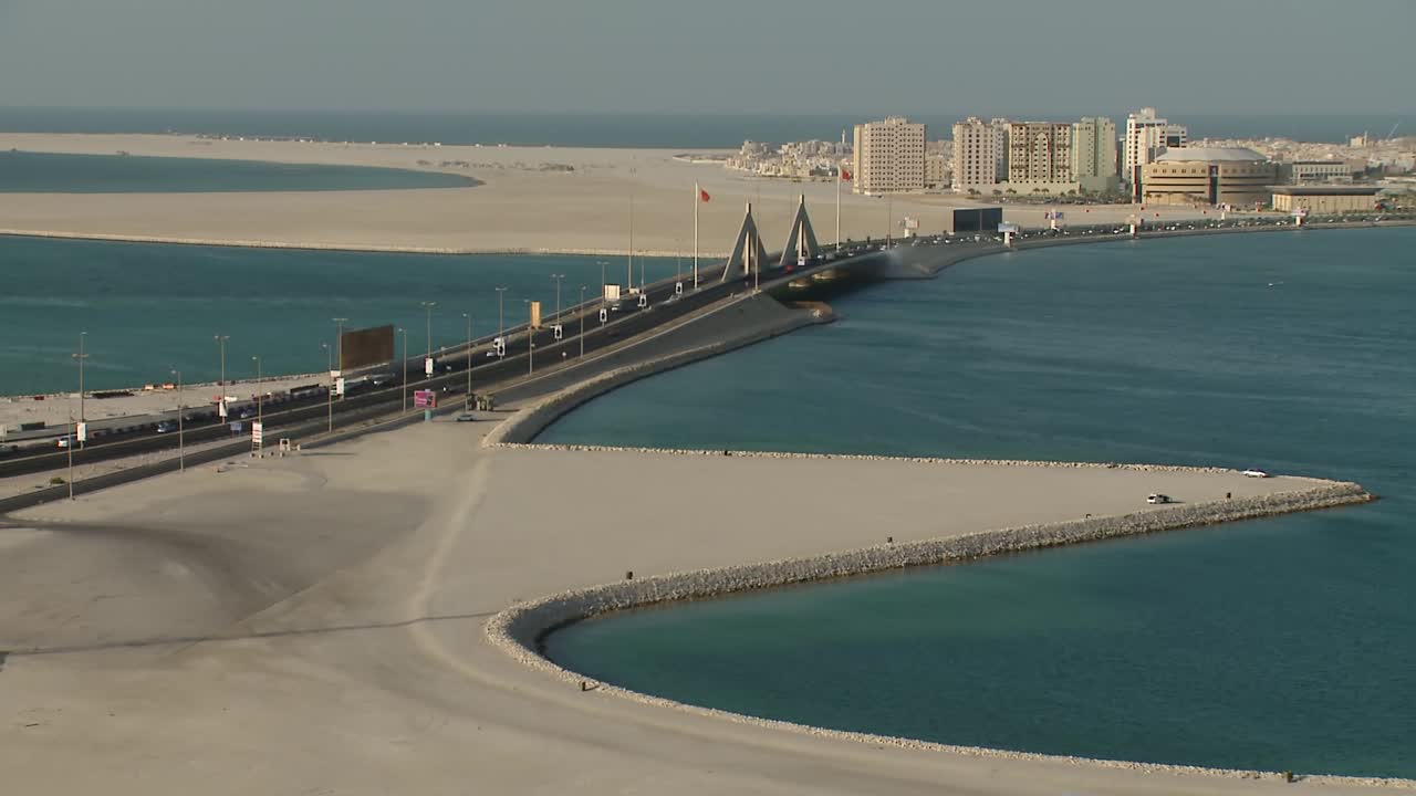 A long and high shot of the King Hamad Causeway linking the capital Manama and the island of Muharraq.
