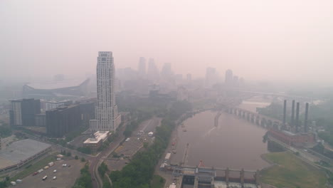 ominous pink skies from wildfire smoke over downtown minneapolis