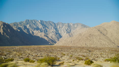 palm springs empty field at sunrise with with the rugged san jacinto mountains rising behind them in california