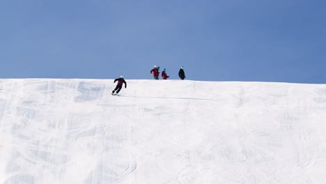 Slow-motion-skiing-of-a-young-male-ski-athlete-in-high-speed-ski-turns-on-a-modern-ski-slope-in-a-ski-resort-in-austria