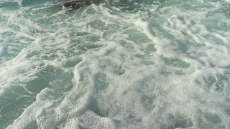 close up of ocean waves splashing along the tenerife coastline in los-gigantes, playa-de-los-guios