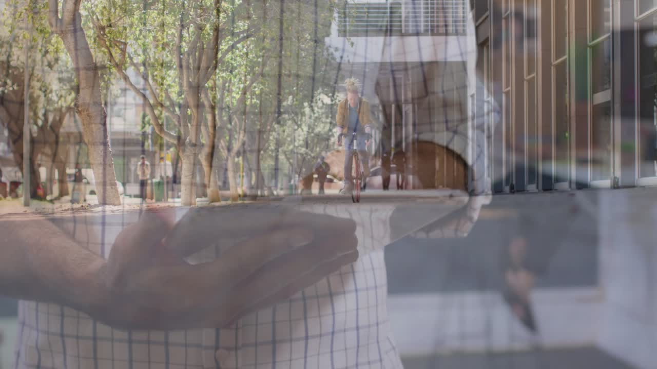 Foreground man tapping phone and initiating finance HUD graphs while cyclist approaching camera