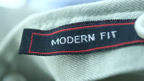 modern fit clothing tag on light gray shirt or pants