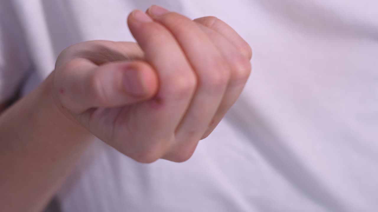 Close up hands of mature caucasian woman taking beauty supplements for glowing skin
