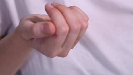 close up hands of mature caucasian woman taking beauty supplements for glowing skin
