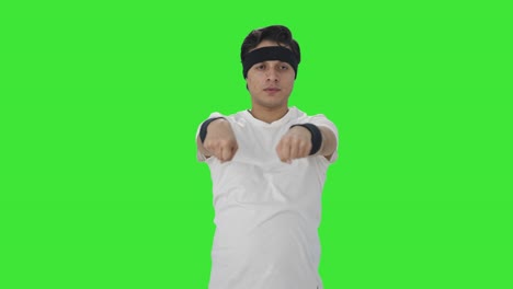 Indian-man-doing-wrist-exercise-Green-screen