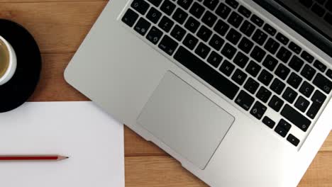 Cup-of-coffee-with-laptop,-pencil-and-paper