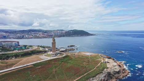 Aerial-towards-Historic-Hercules-tower-la-Coruña-Coastline-Background,-North-of-Spain