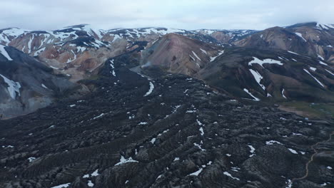 Aerial-view-of-lava-formations-of-eruption-of-Eyjafjallajokull-glacier-and-volcano-in-Thorsmork-highlands-of-Iceland.-The-volcano-in-the-southern-end-of-the-famous-Laugavegur-hiking-trail