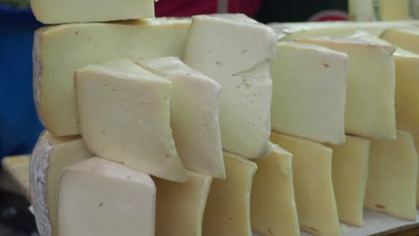 a closeup of stacked blocks of white cheese