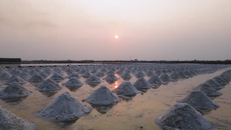 sunset sea salt piles in thailand