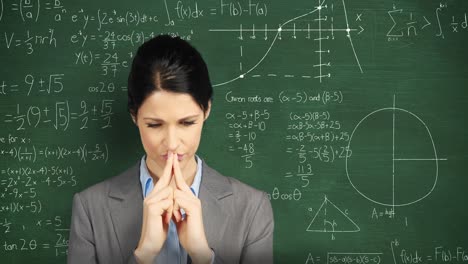 Woman-thinking-in-front-of-chalkboard-with-moving-math-calculations