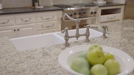 Sink-and-Faucet-on-a-Granite-Island-in-a-Modern-Luxury-Home