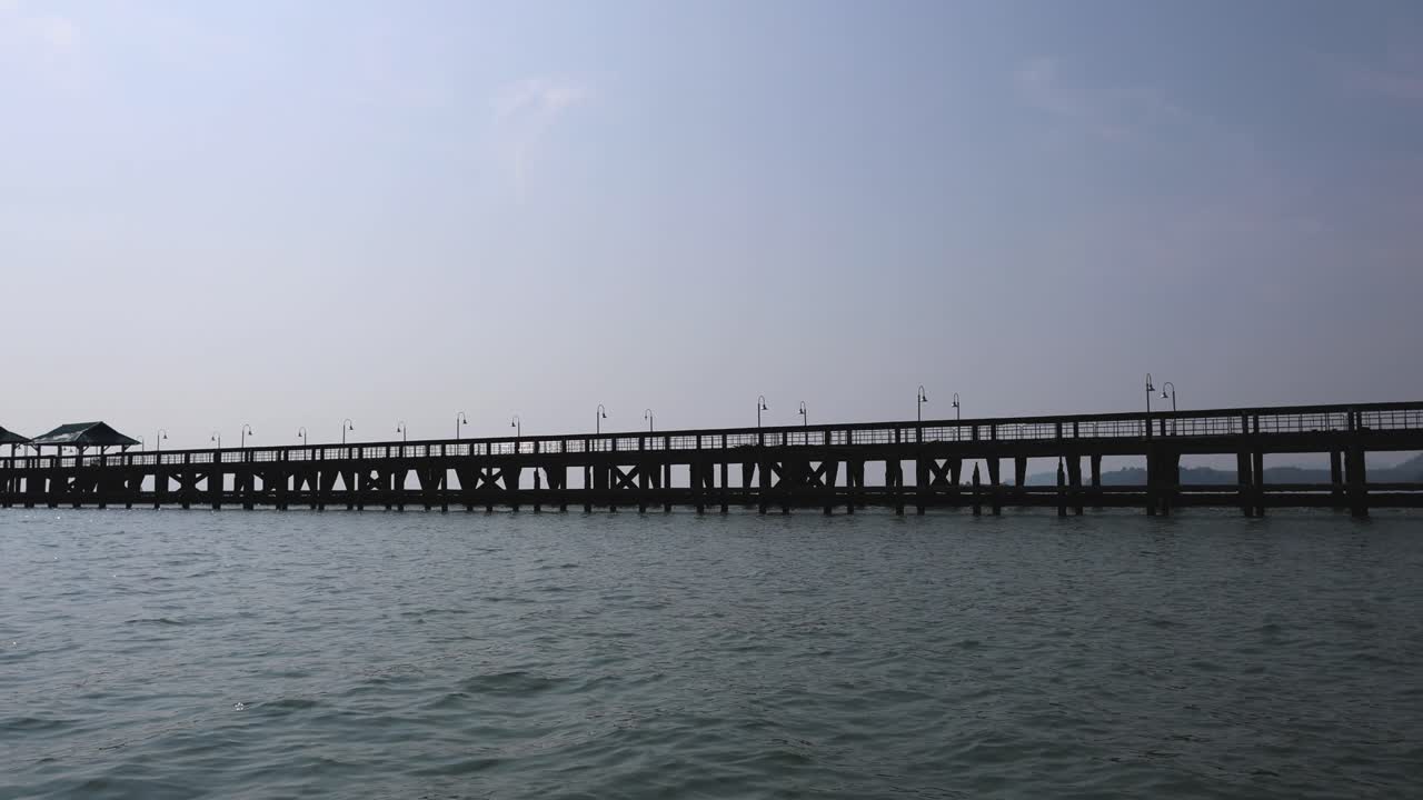 Time-lapse of a tranquil ocean pier scene