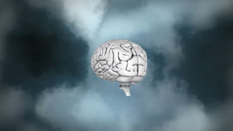 Human-brain-icon-spinning-against-smoke-effect-on-grey-background