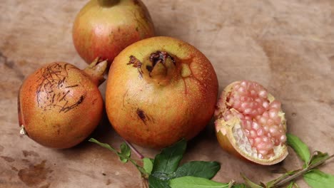 ripe pomegranates on wooden background