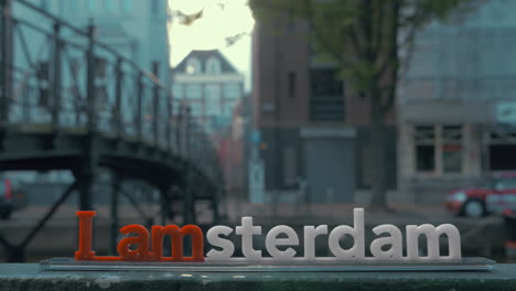 amsterdam slogan and makelaarsbruggetje footbridge