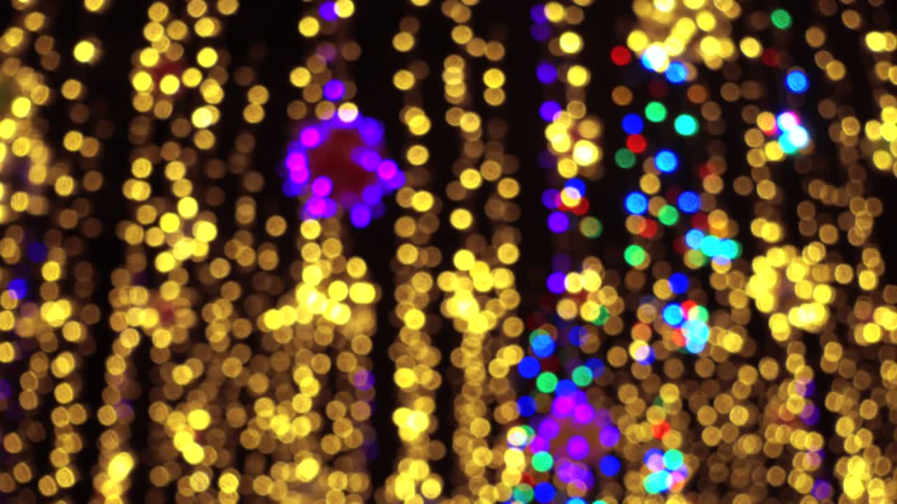 Holiday light, beautiful shiny sparkles. Looped video of beautiful abstract holiday background. Shiny sparkles.